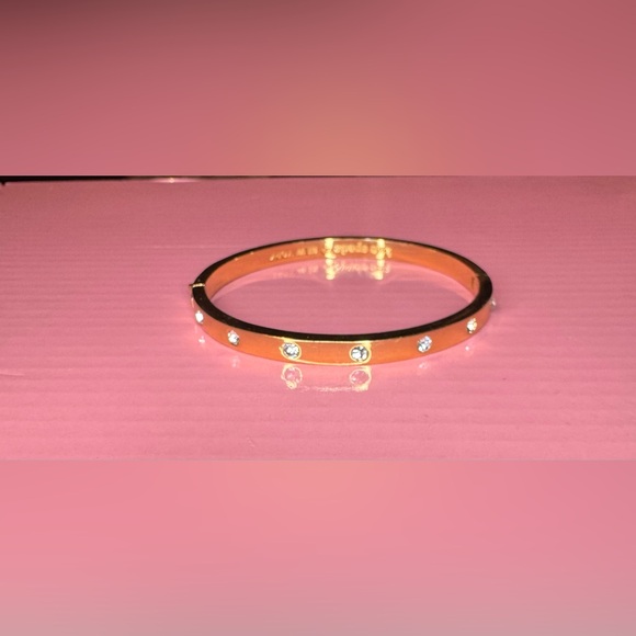 Kate Spade Stone Hinged Bangle in gold-tone plate with crystal embellishments. - Picture 3 of 5